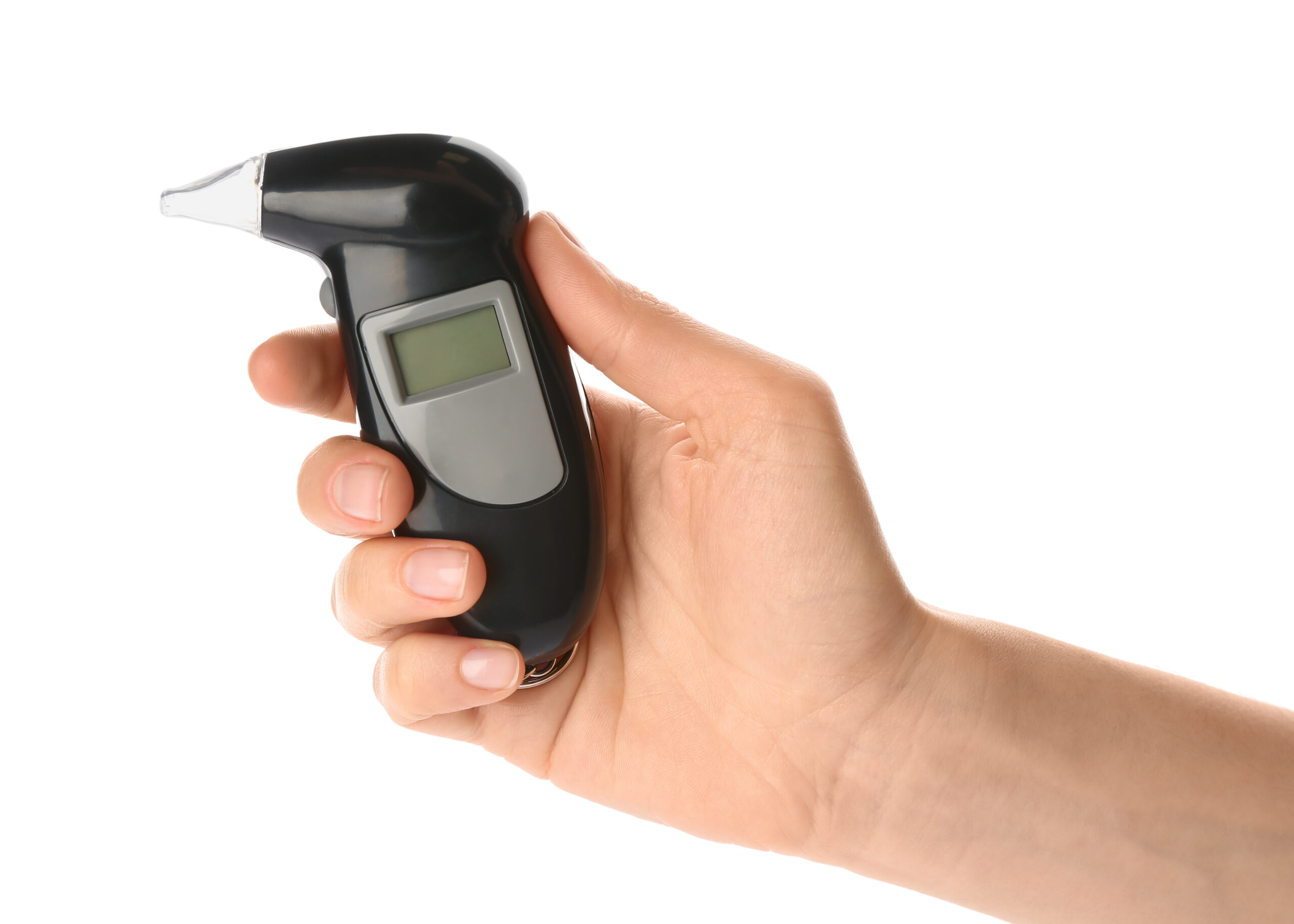 Woman holding modern breathalyzer on white background, closeup